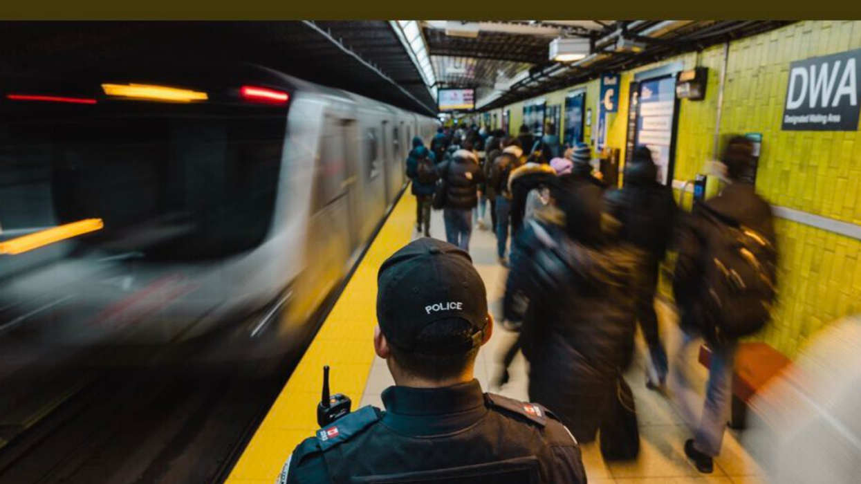 Police officer in subway.