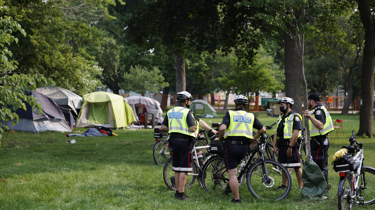 Police presence at a homeless encampment site in 2021.