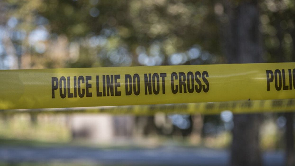 Police tape set up at a crime scene.