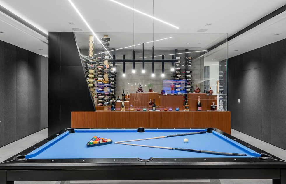 Pool table and wine room in the home.