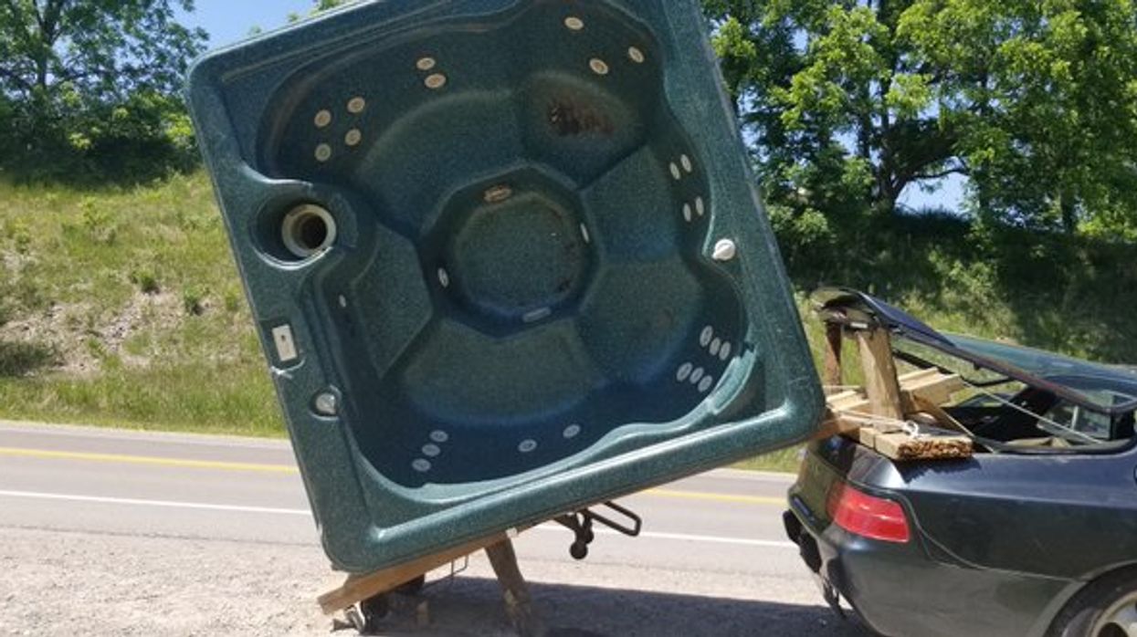 Porsche Pulling A Hot Tub Down The Road Results In An Ontario Man Being Charged