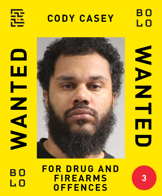 Poster with a man's mugshot and the words "Cody Casey, wanted for drug and firearms offences."