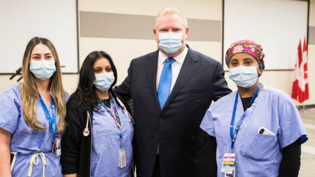 Premier Doug Ford posing for a pic with some hospital staff at Humber River Hospital.