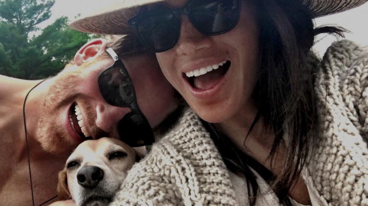 Prince Harry, Meghan Markle and their dog.