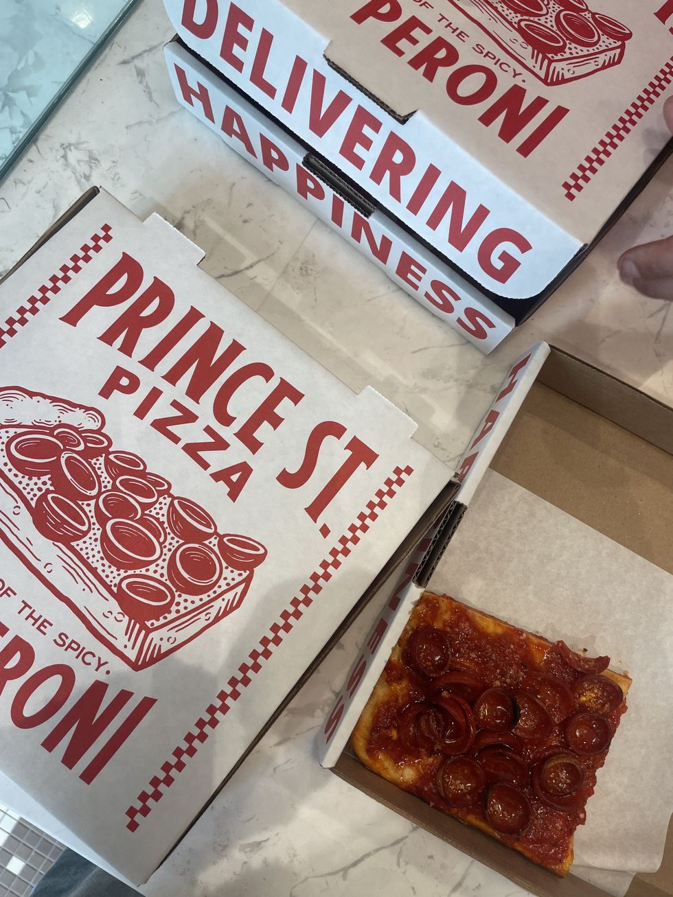 Prince St. Pizza box and pie.