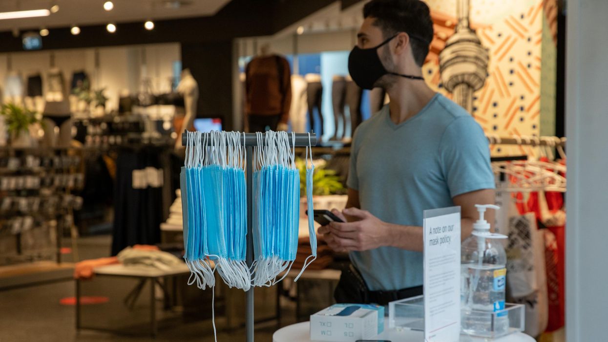 Protective masks being offered at a store.