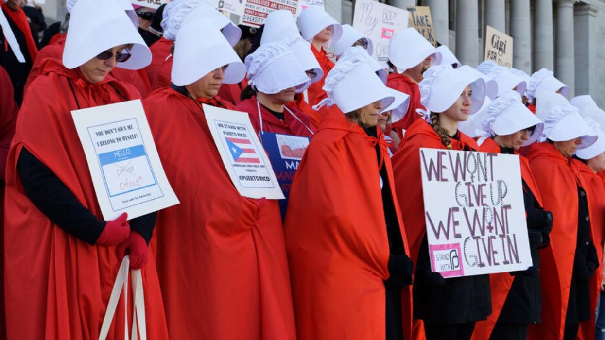 Protesters in 'The Handmaid's Tale' costumes push for abortion rights.