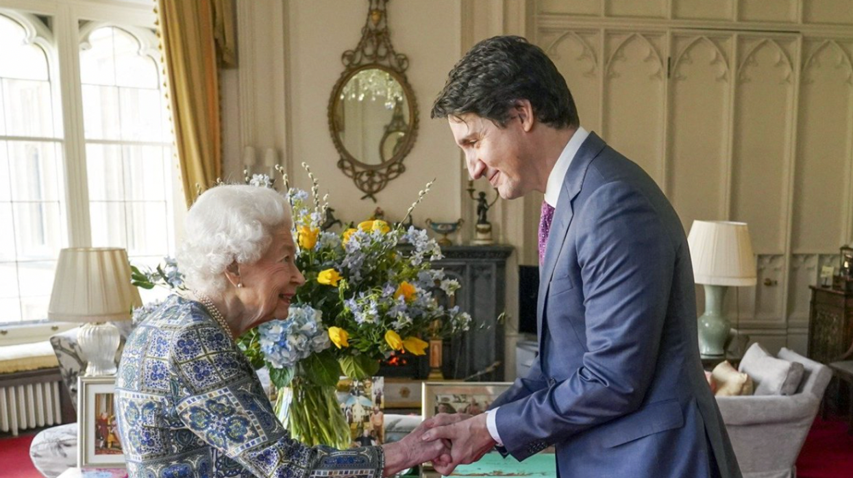 Queen Elizabeth II shaking hands with Prime Minister Justin Trudeau.