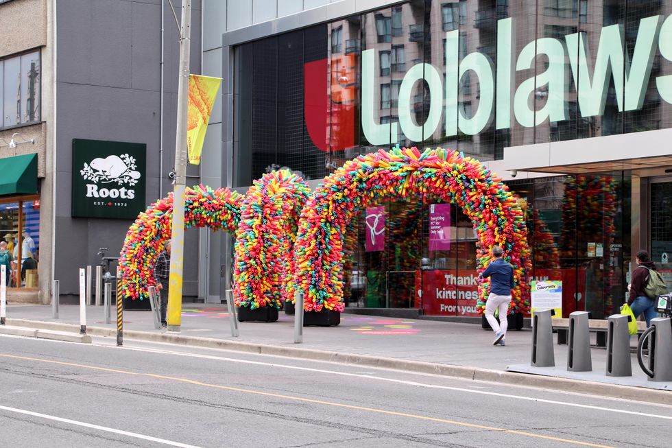 Rainbow walkway made of pool noodles in Toronto.