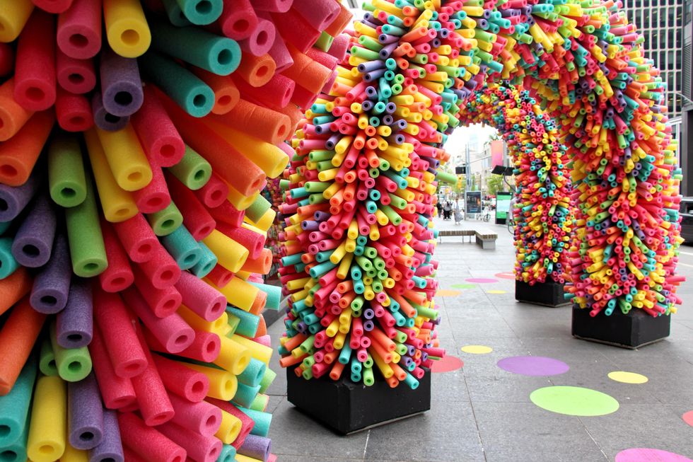 Rainbow walkway made of pool noodles in Toronto.