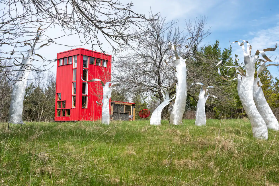 Red Airbnb and art installations.\u200b