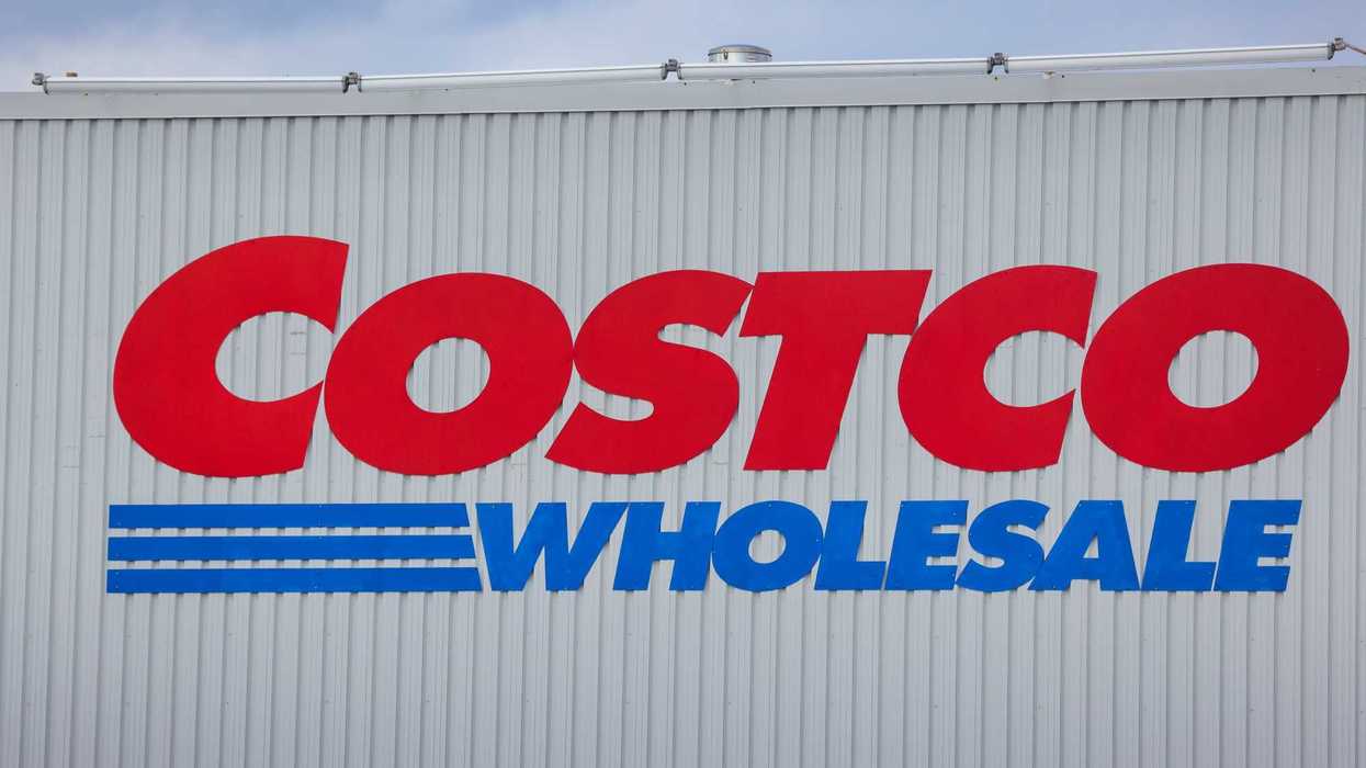 red and blue costco wholesale sign on exterior of store in canada