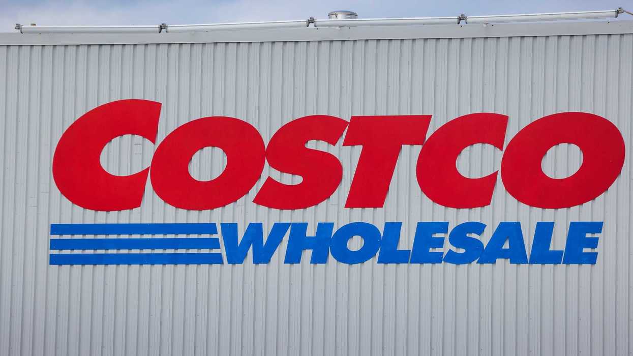 red and blue costco wholesale sign on exterior of store in canada