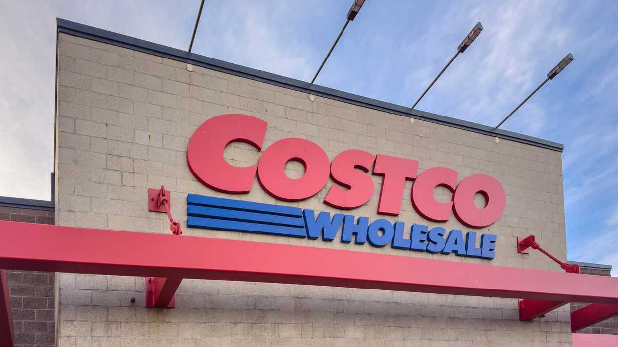 red and blue costco wholesale sign on exterior of store in canada