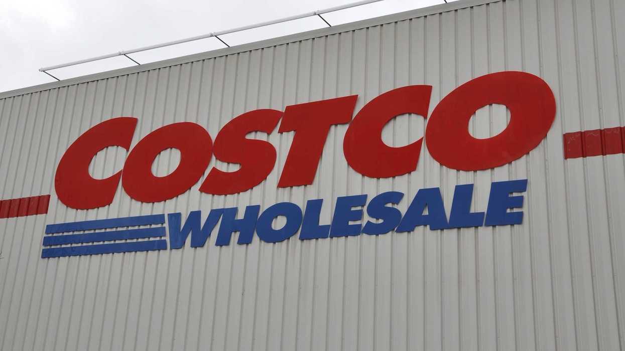 red and blue costco wholesale sign on exterior of store
