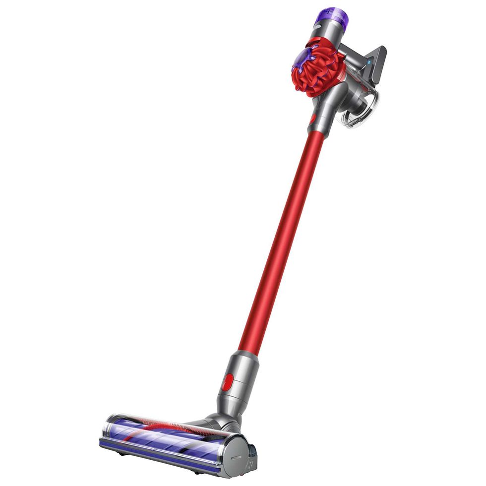Red and silver Dyson cordless stick vacuum cleaner.