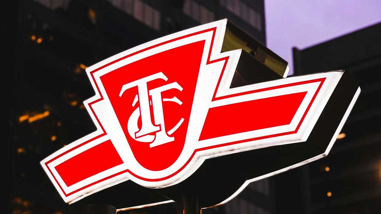 red and white ttc sign on street in toronto