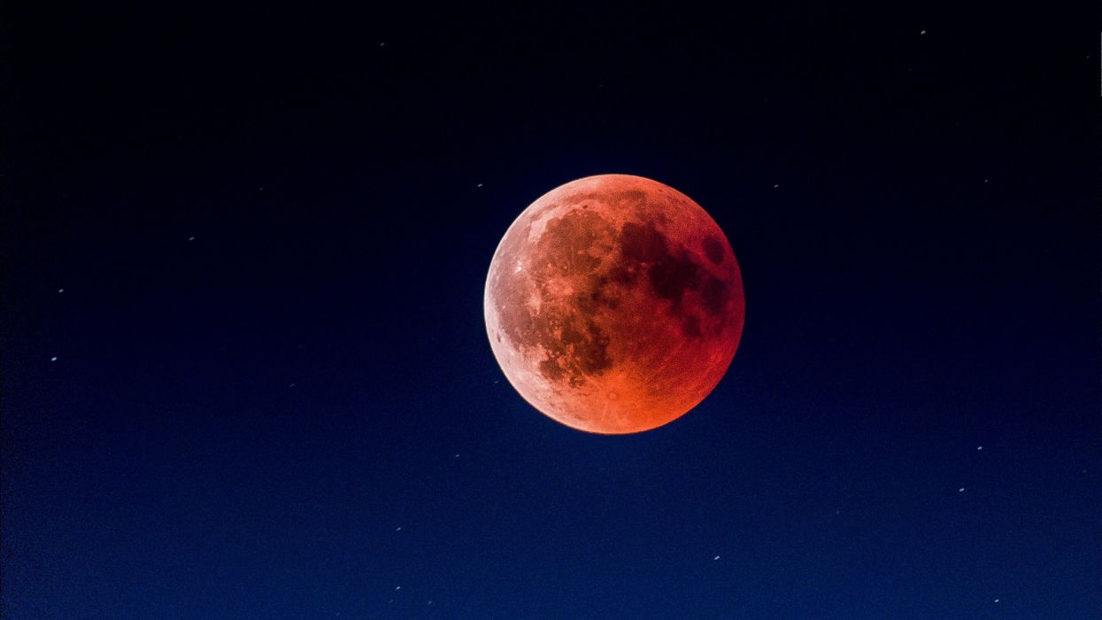 red moon in night sky during total lunar eclipse