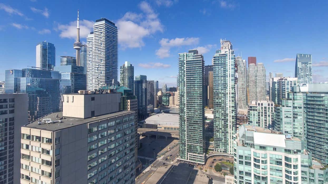 Residential condominiums in Toronto on a blue sky day.