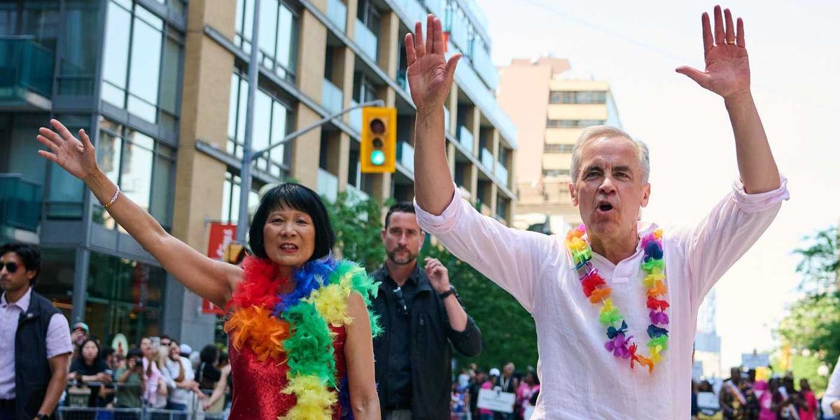 Revellers drench Mark Carney with water as Toronto celebrates Pride Parade Revellers drench Mark Carney with water as Toronto celebrates Pride Parade