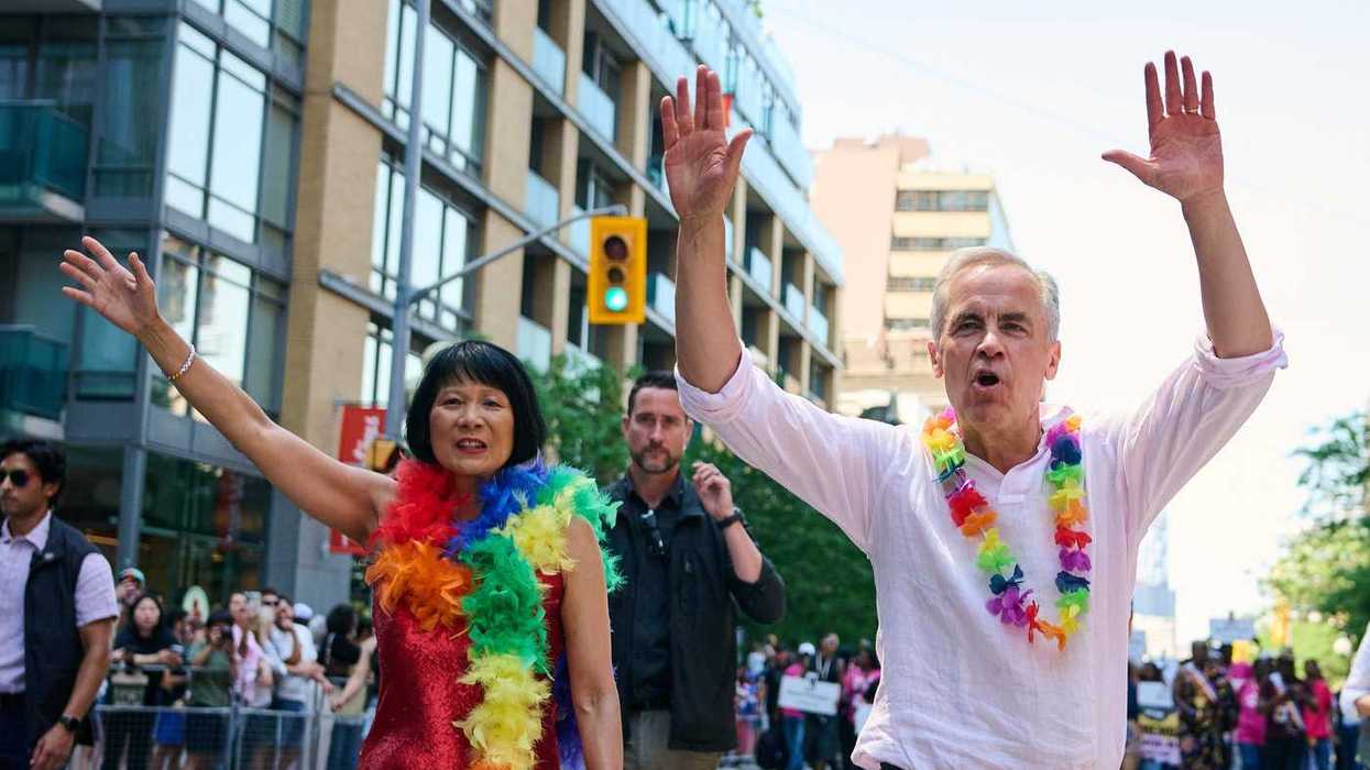 Revellers douse Carney with water at Toronto Pride