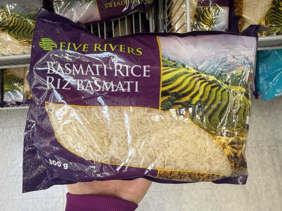 Rice in a purple green bag in a store.