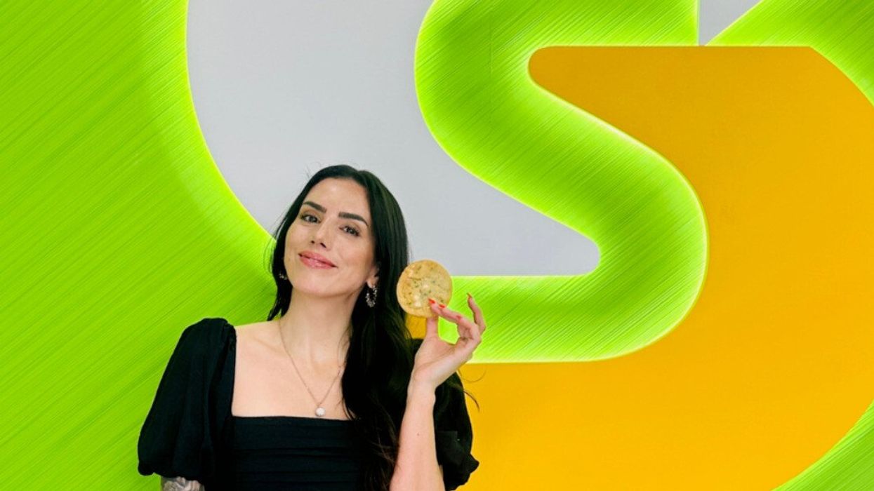 Rini Frey poses with the new Never Miss Lunch Confetti Cookie.