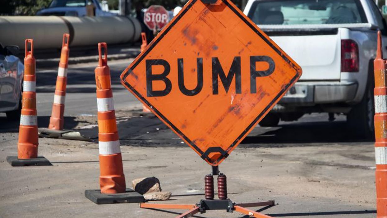 Road sign reading "bump."