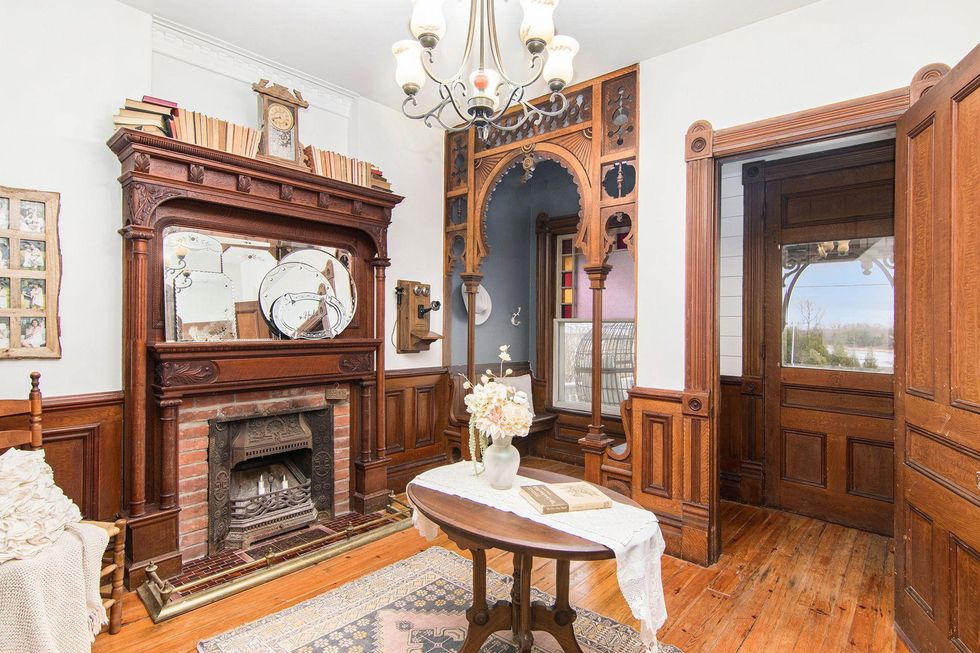 Room with fireplce and small table.