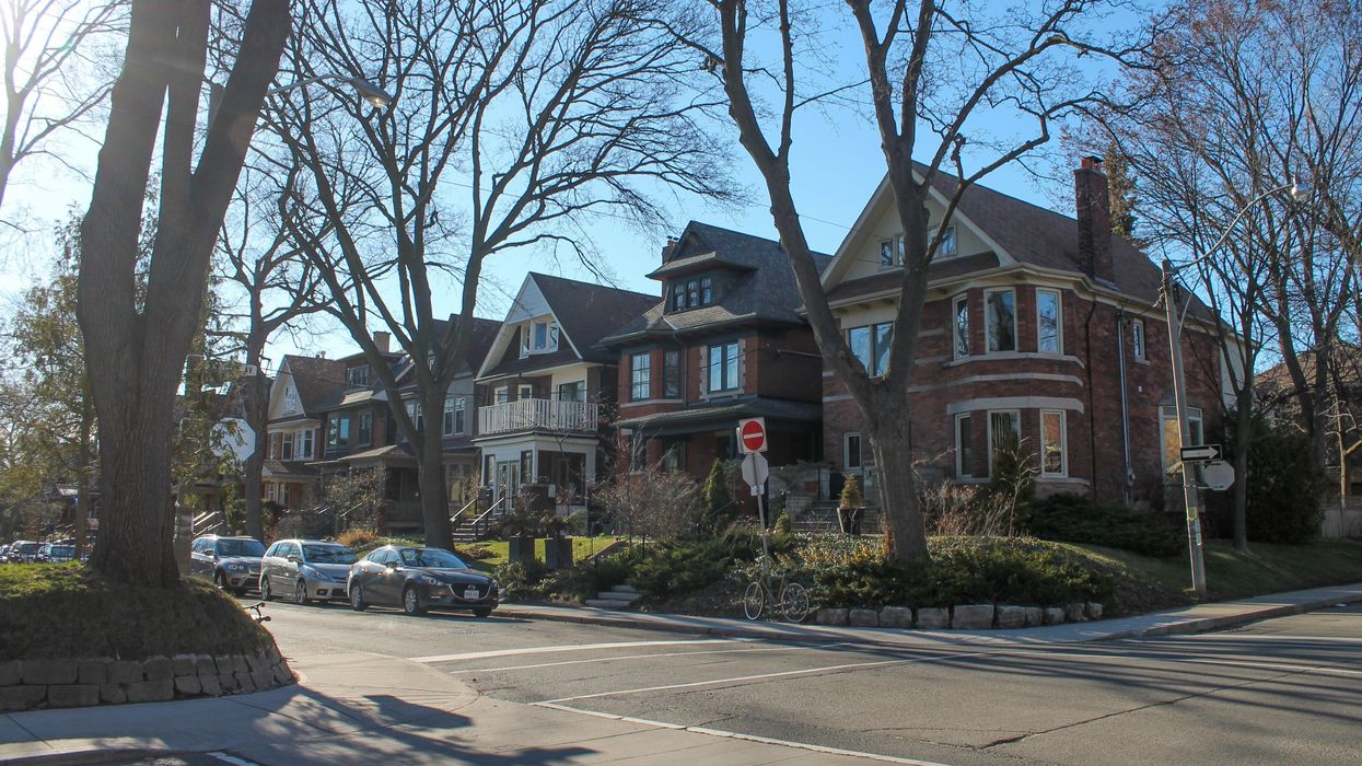 Row of historic Victorian and Edwardian brick homes in High Park, Toronto.