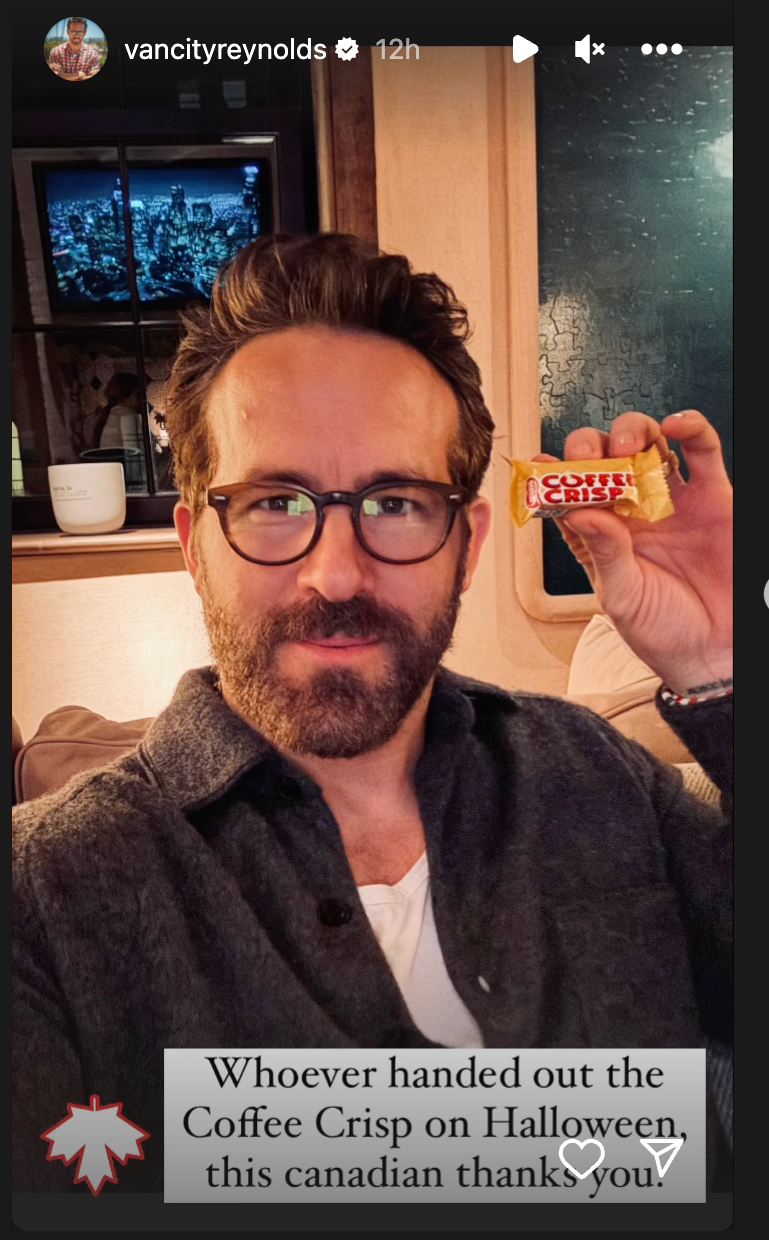 Ryan Reynolds holding a Coffee Crisp with the words "Whoever handed out the Coffee Crisp on Halloween, this Canadian thanks you."
