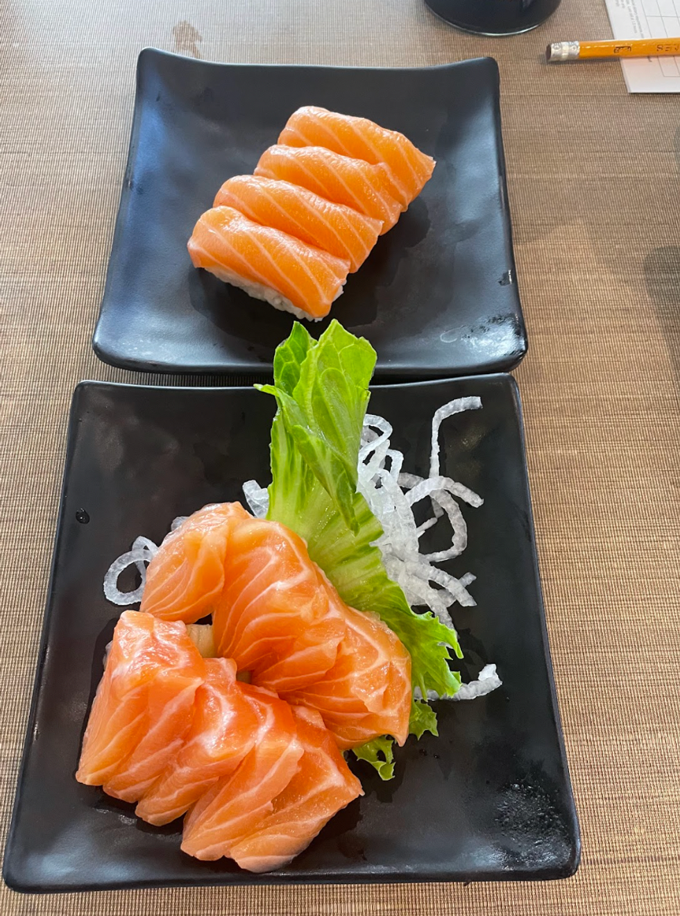 Salmon nigiri and salmon sashimi from Kaka.