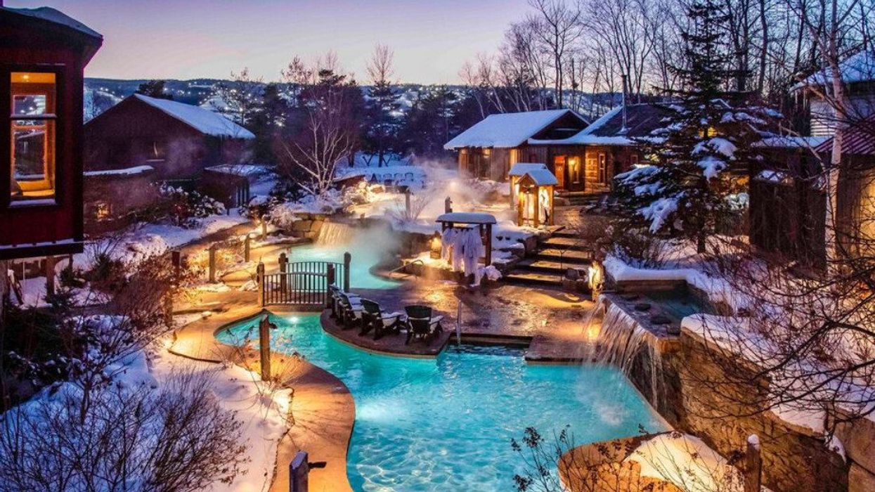 Scandinave Spa Blue Mountain with waterfall and snow.