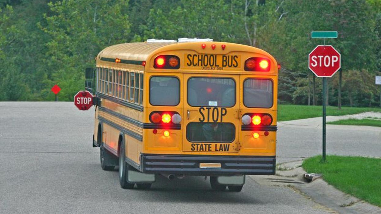 School bus at a stop sign.