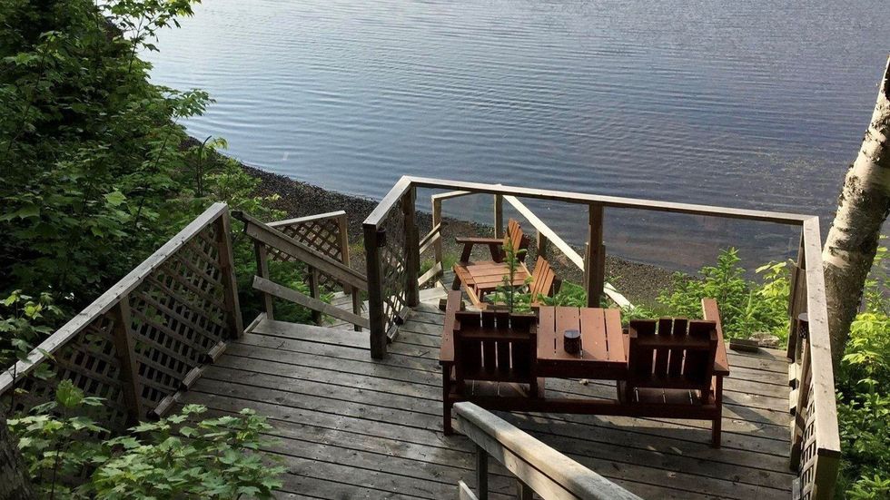 Seating area along the staircase that leads from the house, through the forest and down to the water.
