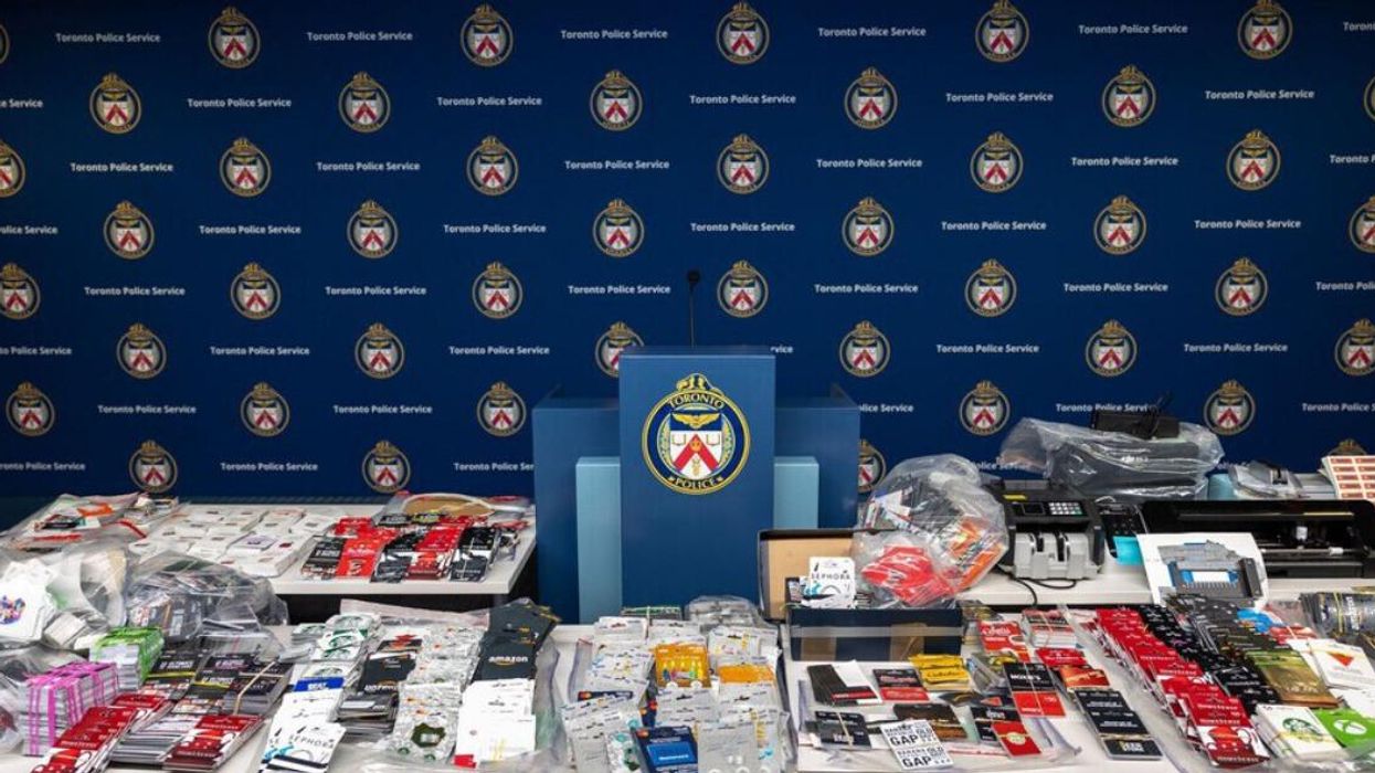 Seized cards and electronics from gift tampering lab.