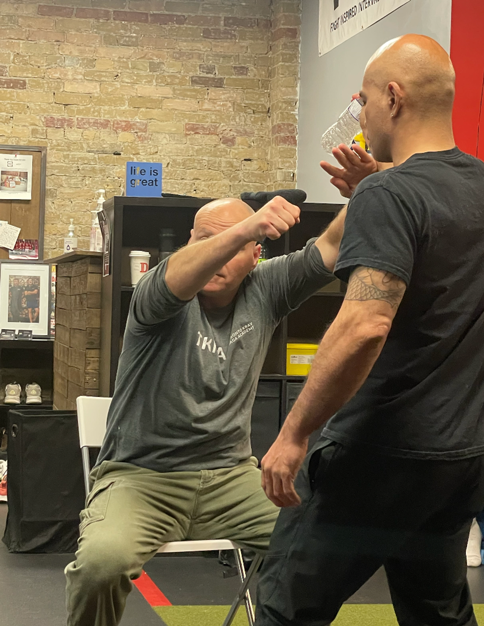 Self-defence while seated.