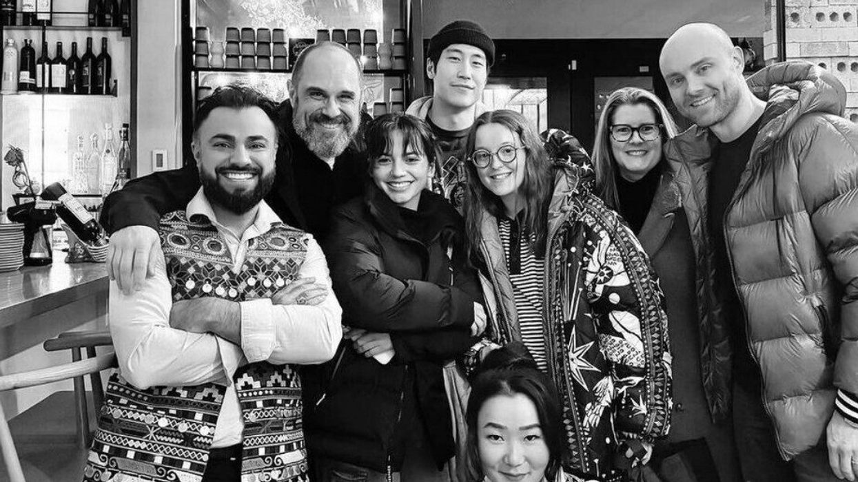 Several cast members of The Last Of Us, including Bella Ramsey and Isabela Merced, with staff at Zarak restaurant in Vancouver, BC.