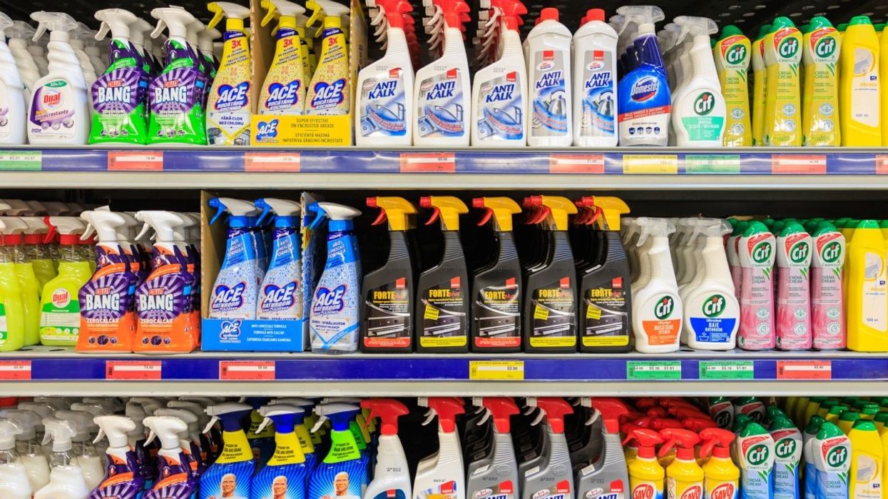 Several cleaning products stacked onto shelves in a grocery store in Canada.