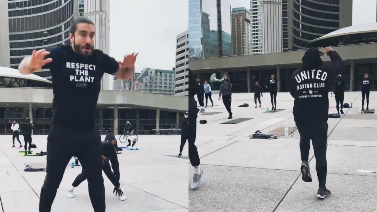 Several people working out in Nathan Phillips Square as part of a protest workout.