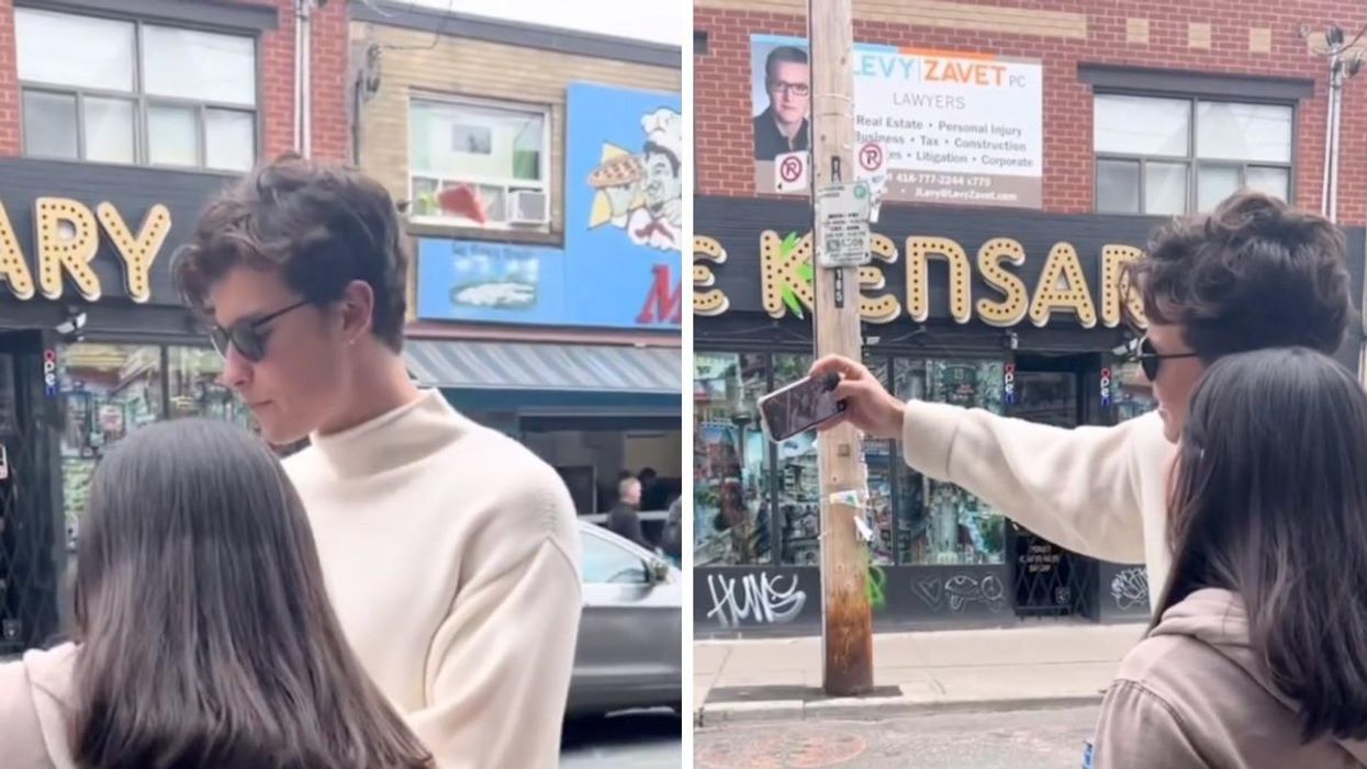 Shawn Mendes taking photos with fans in Kensington Market.