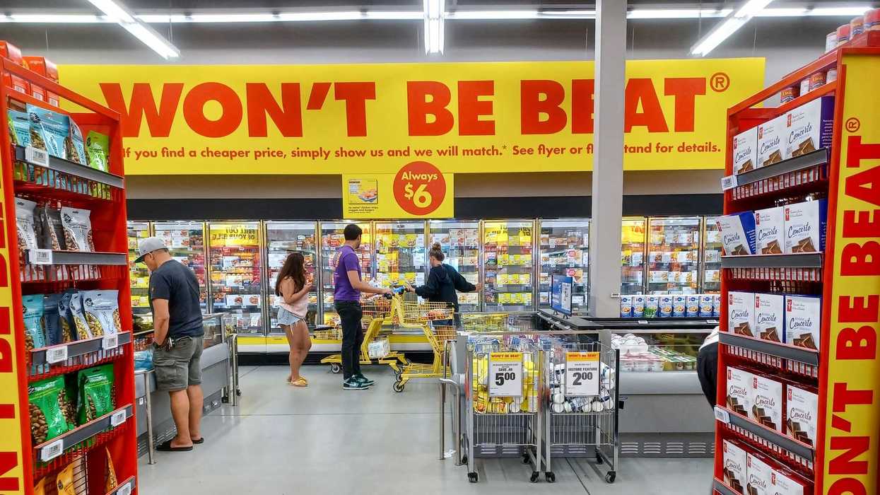 shoppers looking at products in no frills grocery store