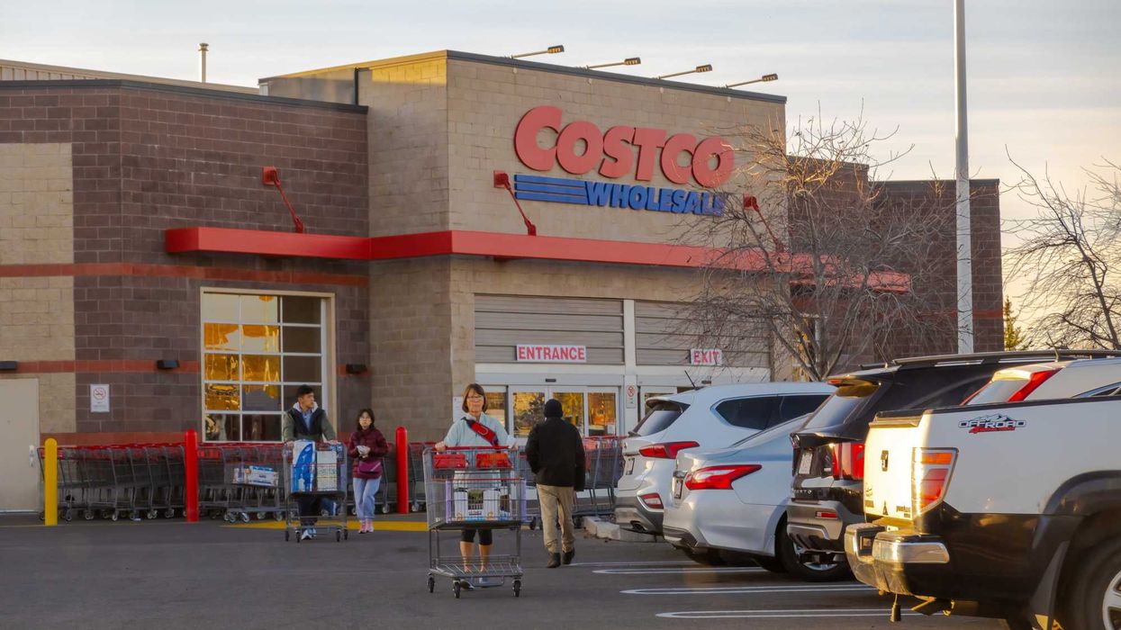 shoppers outside costco store in calgary, alberta