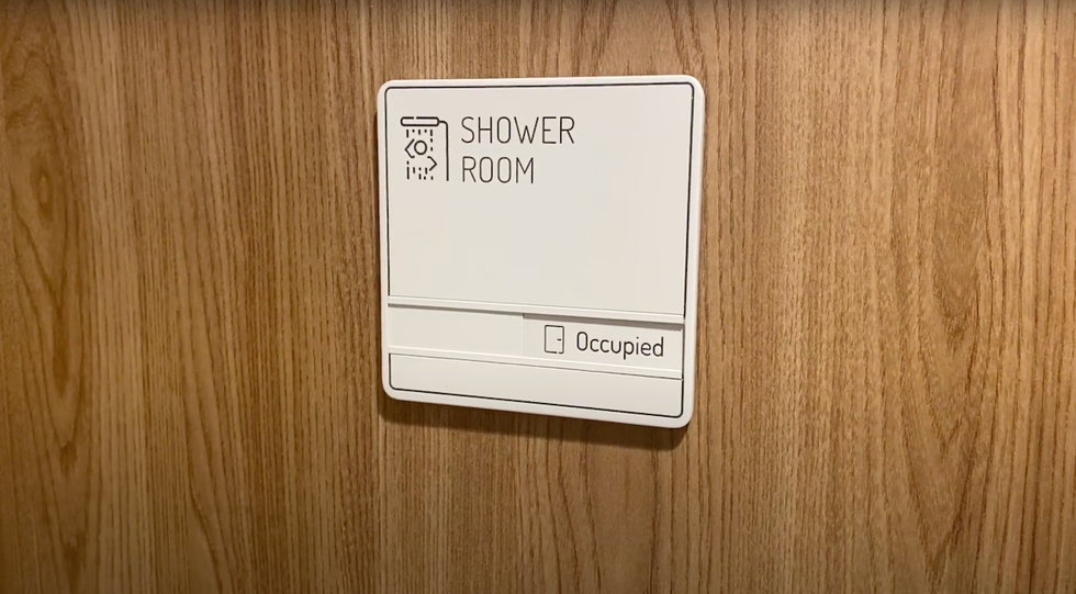 shower room entrance at plaza premium international lounge terminal 3 pearson airport