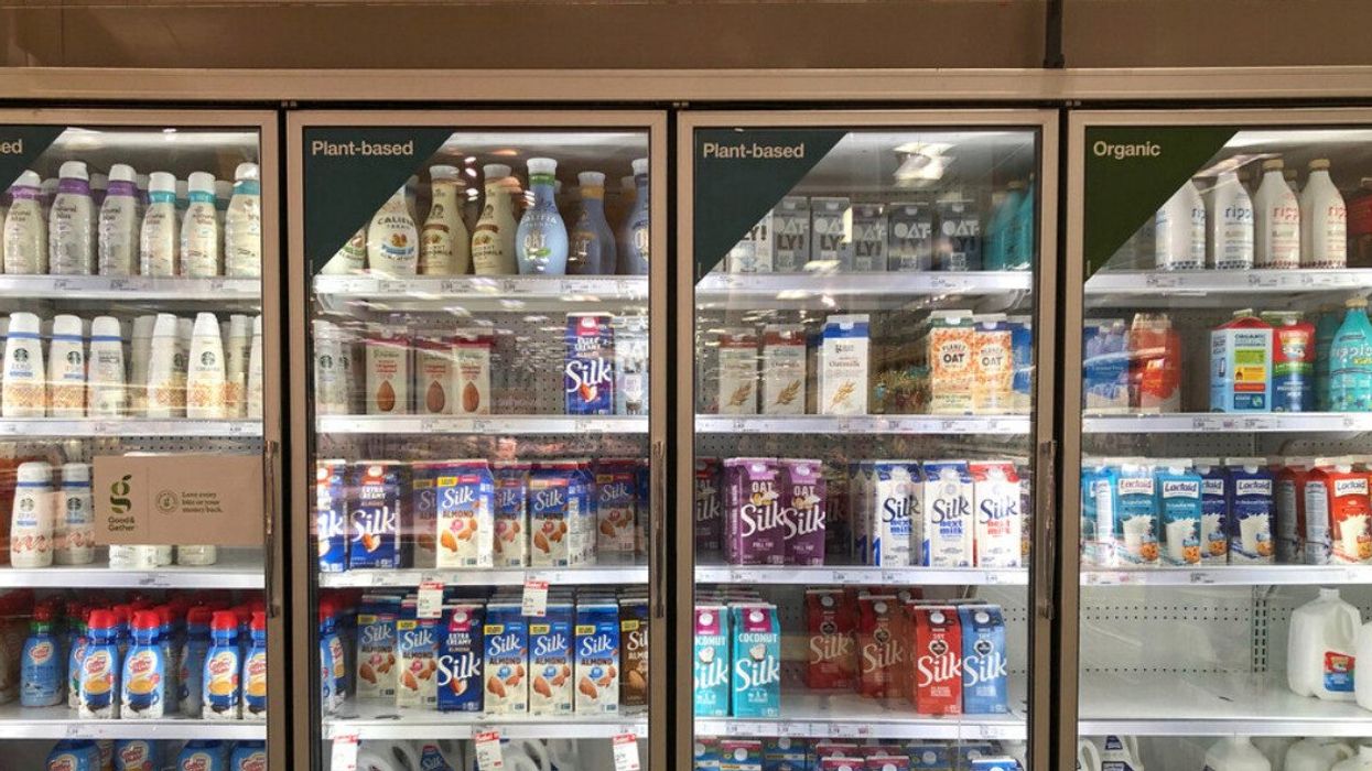 Silk almond milk and other plant-based products in grocery store.