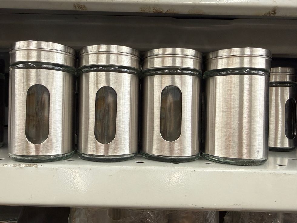 Silver containers on a store shelf.