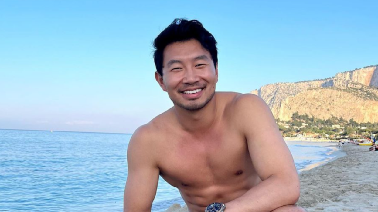Simu Liu on a beach.