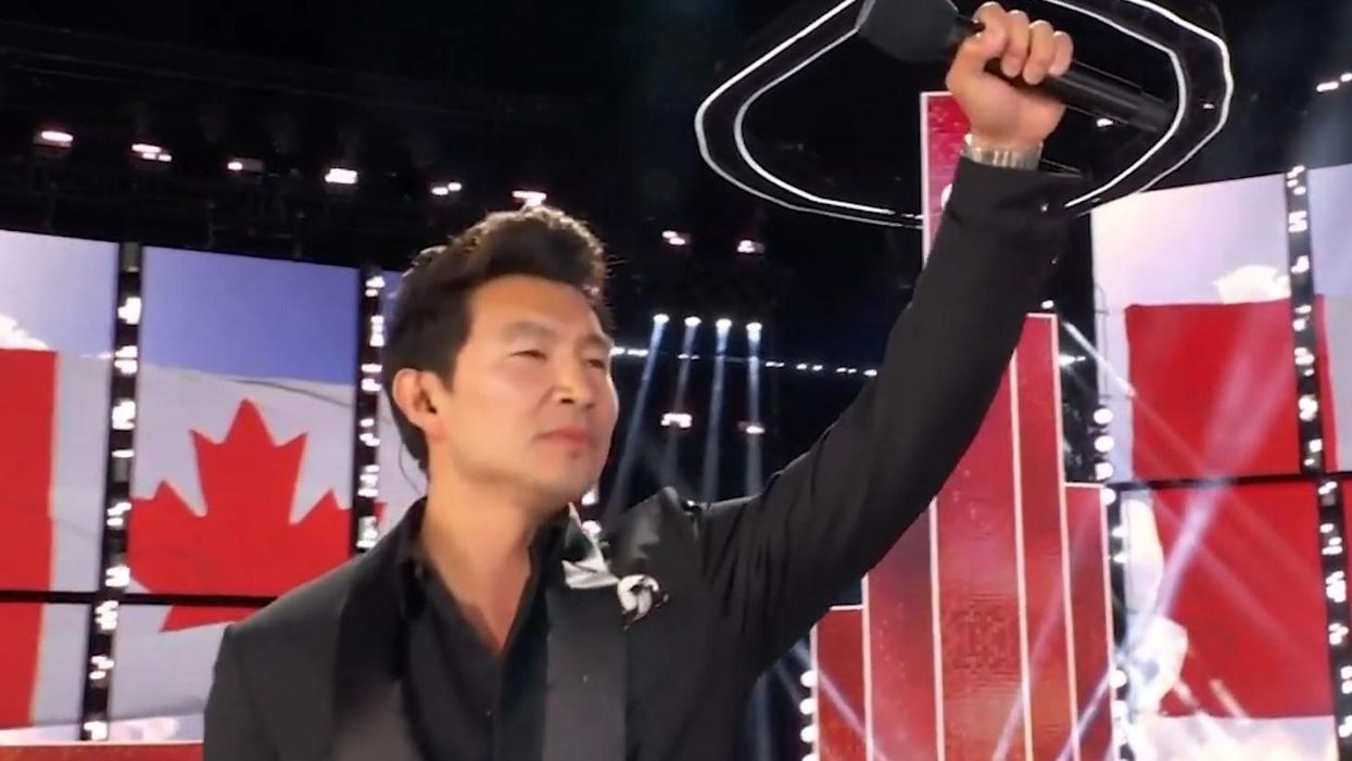 Simu with his fist in the air after his speech.