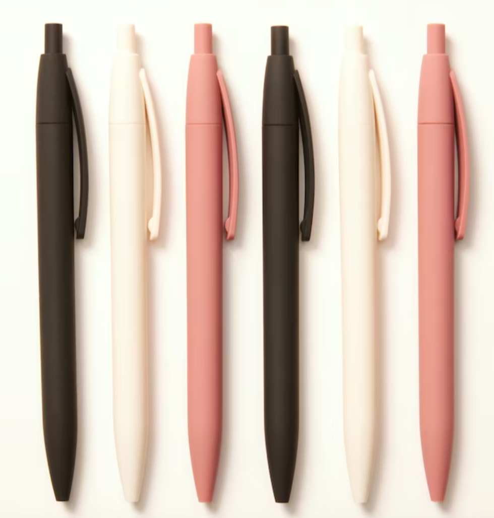 Six pens in black, cream and pink.