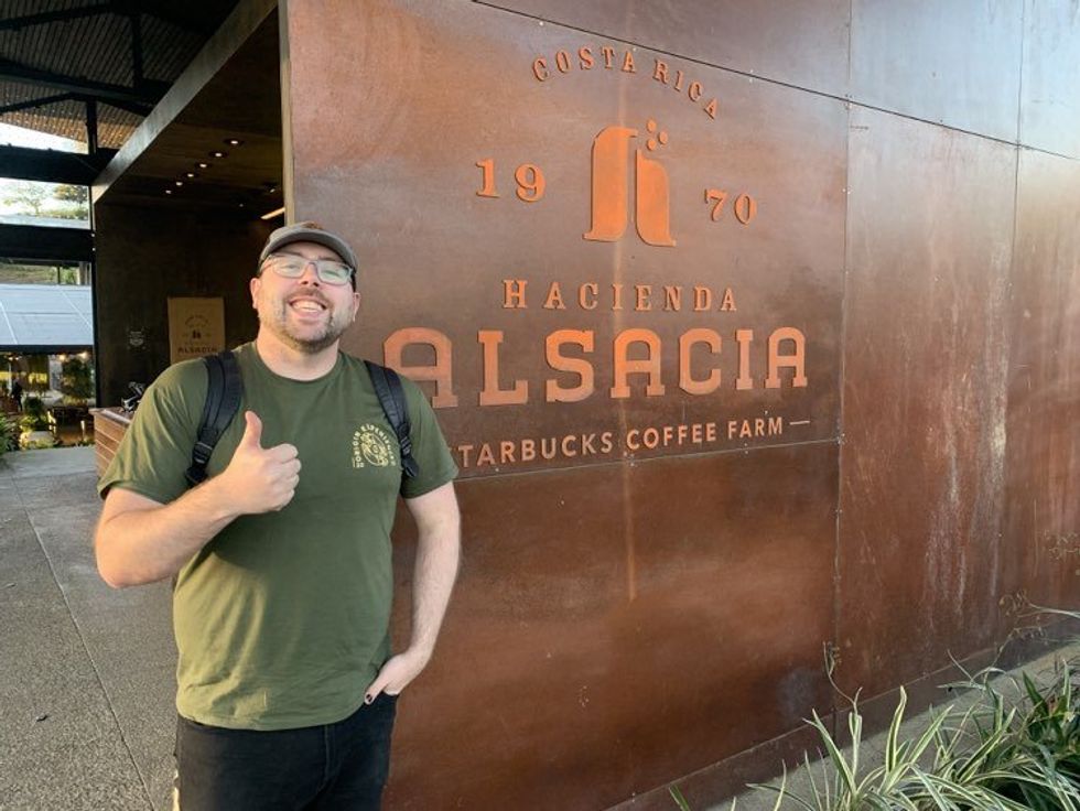 Skyler Skerry gives the thumbs up next to the entrance to Hacienda Alsacia.